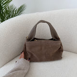 Borsa Charlotte in vera pelle scamosciata con manico in pelle taupe