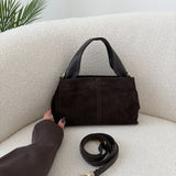 Borsa Charlotte in vera pelle scamosciata con manico in pelle testa di moro