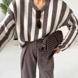 Pullover a righe verticali panna e fango