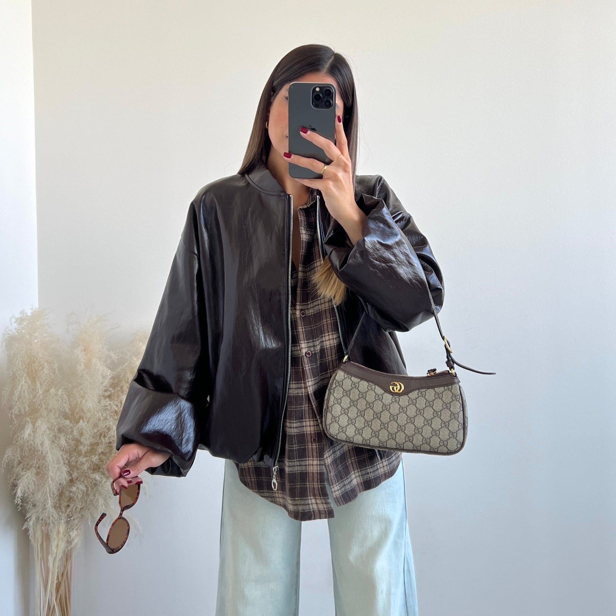 Bomber in vinile con zip testa di moro