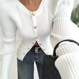 Cardigan bottoni a clip a cuore con manica ad onda bianca