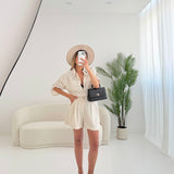 Shorts in lino con bottone