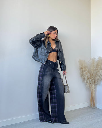 Jeans nero con trama tartan sul retro