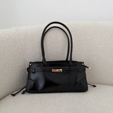 Borsa Jolie con manici lunghi in simil pelle lucida nera