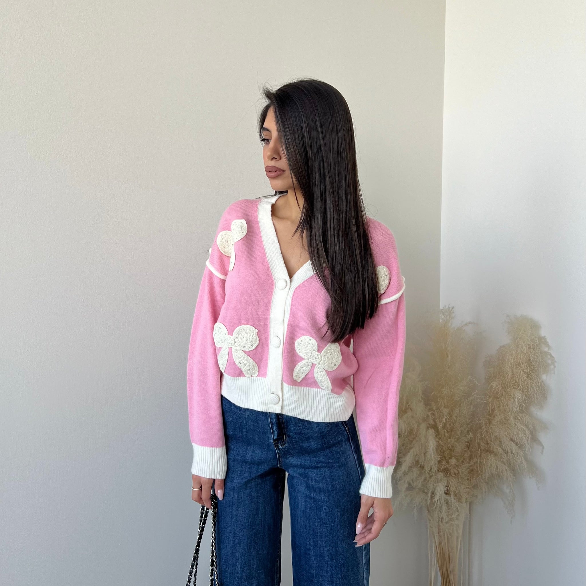 Cardigan con fiocchi rosa