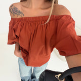 Blusa a barca con schiena scoperta ruggine