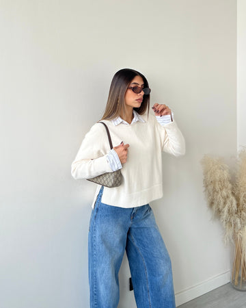 Pull con spacchetti laterali crema