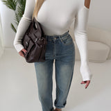 Maglia collo alto cut out laterale crema