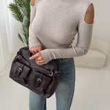 Maglia collo alto cut out laterale sabbia