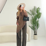 Blusa effetto reso con taglio obliquo in pizzo fango