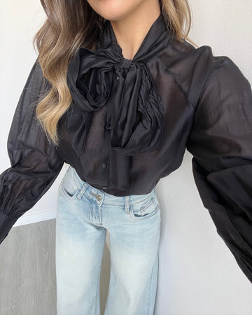 Blusa velata con fiocco nera