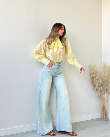 Blusa velata con fiocco gialla