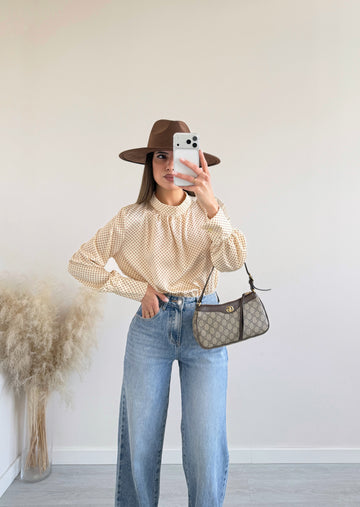 Blusa collo alto a pois gialla