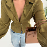 Blusa con fiocco sul retro pistacchio