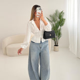 Blusa con fiocco sul retro bianca