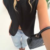 Blazer smanicato obliquo con bottone nero